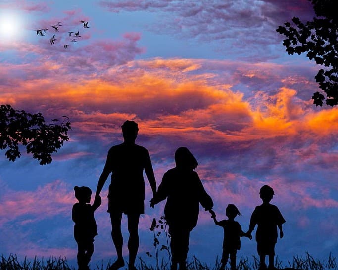 Family walking at sunset - a symbol of hope